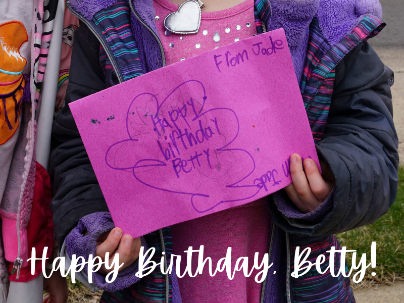 LBA Kindergartener holds a card that says Happy Birthday Betty